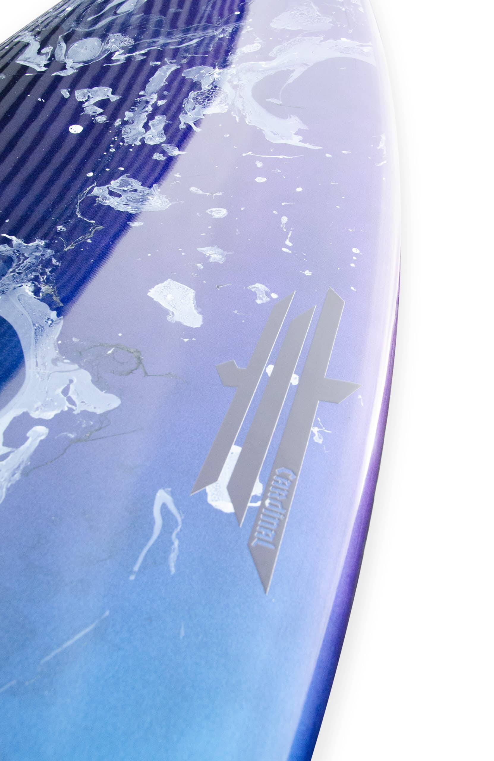 Shapers-Club- A close-up of the Lucky 13 5'9" surfboard features a blue-purple gradient design with white abstract motifs and a logo of three vertical lines above "Fireball". Its high-gloss finish reflects light beautifully, highlighting its elegant details. -surfshop-surfboard